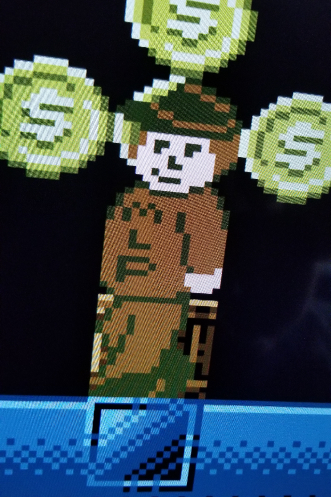 A sprite of cartoony, smug, large man wearing a brown shirt that says MLP while wearing a fedora. 