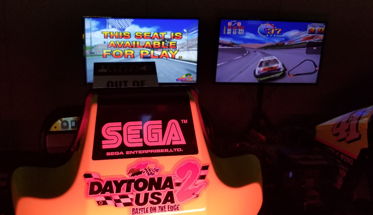 A back view of the arcade game, Daytona USA 2: Battle on the Edge.