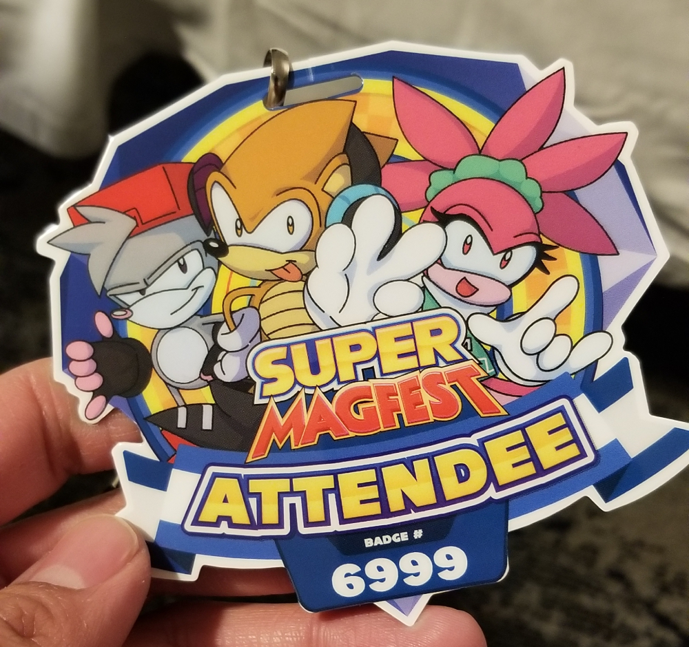 MAGfest's 2025 convention badge. "Super MAGfest Attendee." Featuring a theme of various Sonic the Hedgehog-like mascots.